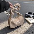 Corduroy crescent handbag in light brown with embroidered bow and ruffled handle detail - Khaki