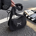 Black corduroy half-moon baguette bag with white bow embroidery and gathered handle - Black