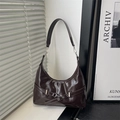Dark brown patent leather shoulder bag with silver buckle detail in chic hobo style - Brown