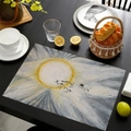 Mexican style linen placemat featuring a golden sun and black animal illustration - Primitive Art Sun