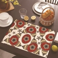 Linen placemat with Mexican style ethnic floral pattern on a dark wooden table - 30cm x 45cm