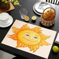 Mexican style linen placemat with yellow cartoon sun print on dark wood dining table - Central Cartoon Sun