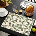 Detailed view of linen placemat with eucalyptus leaf print on a dark wooden dining table - Fresh Eucalyptus Leaf Style (Style-4)