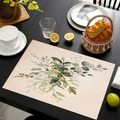 Linen placemat with botanical watercolor leaf patterns on a black wooden dining table - Apricot Watercolor Leaves Style (cd-1-7) / 45cmx30cm