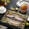 Linen placemat detail showing welcome text and floral wreath on light wood grain - Welcome Natural Wood Style (cd-1-8) / 45cmx30cm