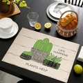 Macro detail of linen placemat featuring green cactus print and heat-resistant texture - Life Happens Plants Help