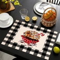 Close-up of linen Christmas placemat with gingerbread cupcake and black plaid borders - Gingerbread Cupcake Style (Style-3)