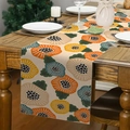 Runner da tavola in lino con motivi floreali moderni su un tavolo da pranzo in legno scuro - Floreale a Pois Arancione Giallo Verde