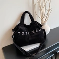 Large black corduroy tote bag with TOTE BAG embroidery and minimalist wavy edge design - Black