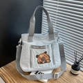 Cute light blue nylon capybara tote bag with adjustable straps and multi-pocket design - Blue