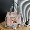Pink nylon tote bag with cute capybara print and gray adjustable crossbody strap - Pink
