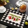 Linen Christmas placemat with festive stockings and candy canes on a black wood table - Christmas Stocking Holly Style (11)