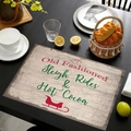 Set de table de Noël en lin avec motif traîneau rouge sur une table en bois noir - Style Traîneau Vintage