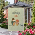 Garden flag detail showing two cute owls and Life is beautiful always text in a garden - Owl Pair Style