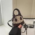 Mini shell-shaped crossbody bag in vintage brown leather with monogram canvas detail - Coffee & Khaki