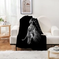Close-up of black flannel lion blanket draped on a modern white armchair in home setting - Lion Side Profile (Style-10)
