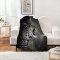 Realistic black and white cheetah print flannel blanket draped on a modern sofa - Roaring Cheetah Style (Style-15)