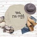 Flat lay of beige sweatshirt with 'Yes I'm Cold' text, autumn accessories and pine cones - S / Sand