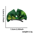 Green St. Patrick's Day clover bow hair clip with measurement and weight details - Shamrock Green Bow Clip