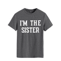 Close-up of white I'M THE SISTER bold letter print on dark grey cotton round neck t-shirt - S / Dark Gray (White Font)