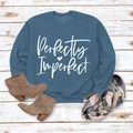Flat lay of blue sweatshirt with 'Perfectly Imperfect' print, scarf and brown boots - M / Blue Sweatshirt (White Font)