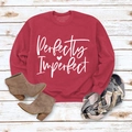 Flat lay of red sweatshirt with Perfectly Imperfect print, plaid scarf and tan boots - M / Red Sweatshirt (White Font)