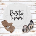Flat lay of Perfectly Imperfect white sweatshirt with a heart print on rustic wood - M / White Sweatshirt (Black Font)