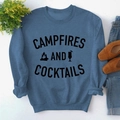 Flat lay of blue sweatshirt with Campfires and Cocktails text and graphics - S / Blue Sweatshirt (Black Font)