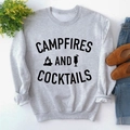 Flat lay of gray sweatshirt with Campfires and Cocktails print on a white surface - S / Grey Sweatshirt (Black Font)