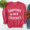 Flat lay of a red sweatshirt with Campfires and Cocktails print and casual accessories - S / Red Sweatshirt (White Font)