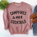 Pink crewneck sweatshirt with Campfires and Cocktails print styled with casual accessories - S / Rose Gold Sweatshirt (Black Font)