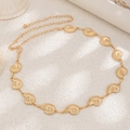 Close-up of golden shell body chain with nautilus pendants and adjustable lobster clasp - Gold Conch Nautilus Style (01702) / Gold
