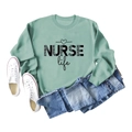 Flat lay of sage green NURSE life sweatshirt with leopard print and casual accessories - S / Light Green (Black Font)