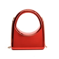 Glossy bright red acrylic handbag with circular handle and gold chain shoulder strap - Red