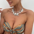 Detail of silver starfish and scallop pendants on a chunky chain necklace for beach style - Silver