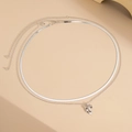 Detail of silver double-layered snake chain belt featuring a 3D bow pendant accessory - Snake Chain With Bow Knot Pendant (06003) / Silver