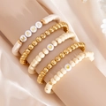Detail of 5-piece bohemian beaded bracelet set with gold hearts and MAMA letter beads - Wood Polymer Clay Puzzle Style (06037)