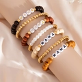 Detail of 5-piece bohemian beaded bracelet set featuring MAMA letter beads and heart charms - Multicolor Wood Letter Style (06039)