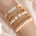 Macro detail of Bohemian beaded bracelet set featuring MAMA letters and heart charms - Beige Wood Heart Style (06040)