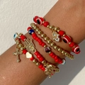 Set di braccialetti etnici con perline rosse malocchio e ciondoli a croce in metallo oro - Set Amuleto Malocchio Rosso (06127)