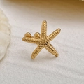 Macro detail of gold starfish ear cuff showing lifelike grain texture and metallic finish - Gold Sea Star Style (03550)