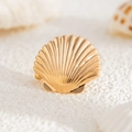 Golden starfish ear cuff with textured shell details on a beach-inspired background - Gold Shell Style (03551)
