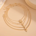 Close-up of 5-piece gold heart pendant necklace set with varied chain styles and textures - Heart Theme Multi-Layer Style (06026) / Gold