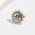 Macro shot of antique silver ear cuff featuring a mystical sun and moon face design - Antique Silver Sun Moon Face Style (03556)