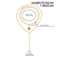 Detailed view of layered gold cross and sunflower pendant necklace weighing 55.6g - Gold (06902)