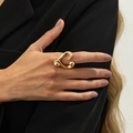 Detailed view of an abstract gold heart open ring worn on a finger with a luxury metal finish - Gold / Abstract Heart Shape (00961)