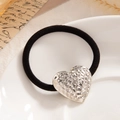 Elastic hair tie with a silver heart pendant featuring a unique hammered texture design - Hammered Heart Silver (0072)