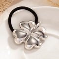 Elegant black elastic hair tie with silver heart-shaped clover pendant for ponytails - Silver Clover (0068)