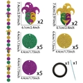 Detail view of Mardi Gras party banner components with masks and glitter paper circles - Purple Gold Green Mask & Circle Style