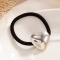 Elastic black hair tie featuring a polished silver metallic 3D heart pendant charm - Mirror Finish Large Heart Silver (0092)